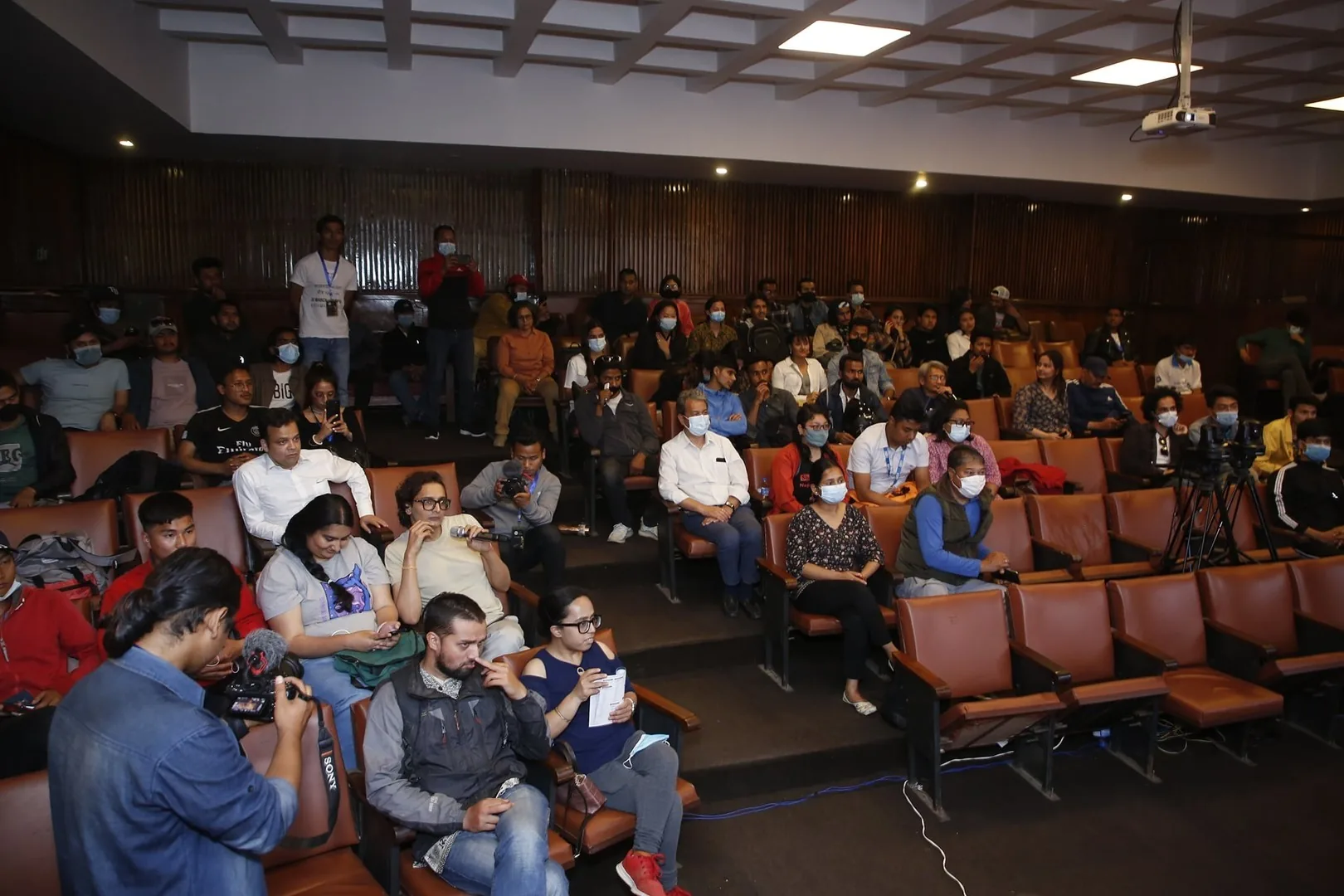 Filmmakers, press and students filling the auditorium at an NFCA programme in Kathmandu